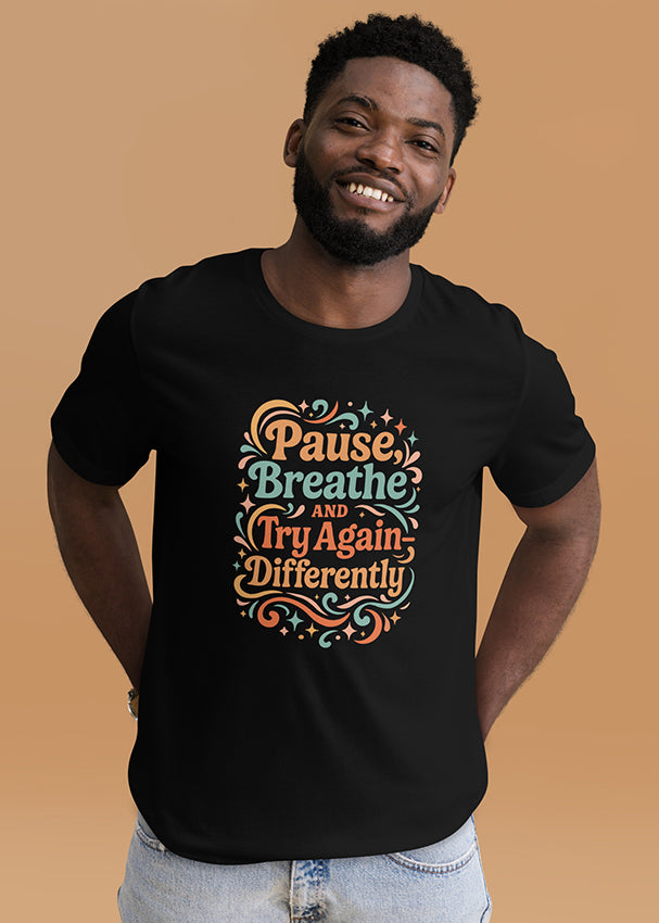 Model wearing the Pause & Breathe colorful retro T-shirt, front view.