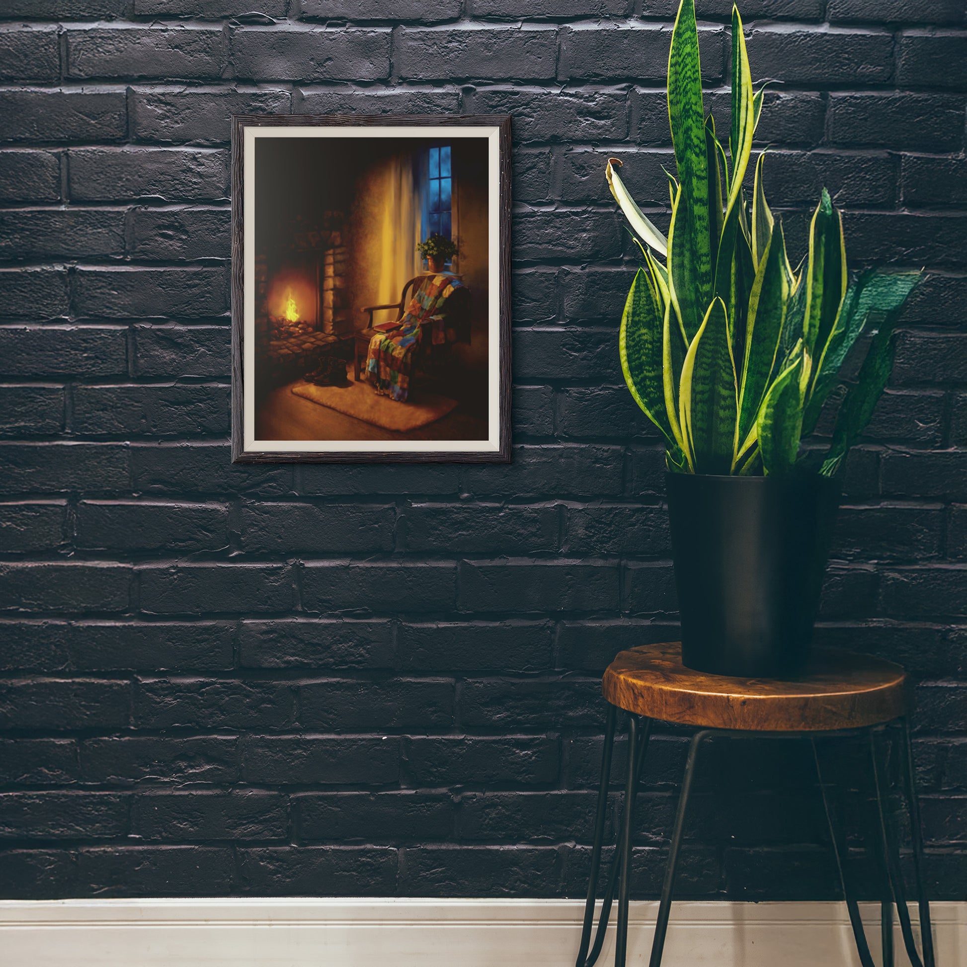 Hearth Corner art print framed against a dark brick wall with a tall green plant nearby