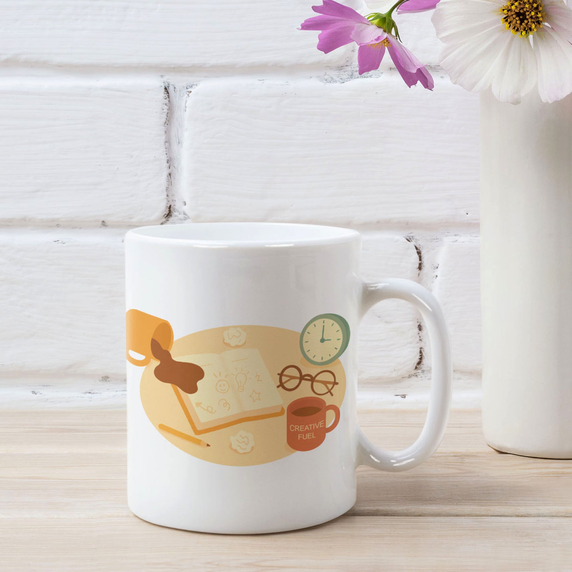 White ceramic mug featuring a playful late-night creativity illustration with coffee, notebooks, and a clock, shown in a styled product mockup with flowers and a white brick background for wid Designs.
