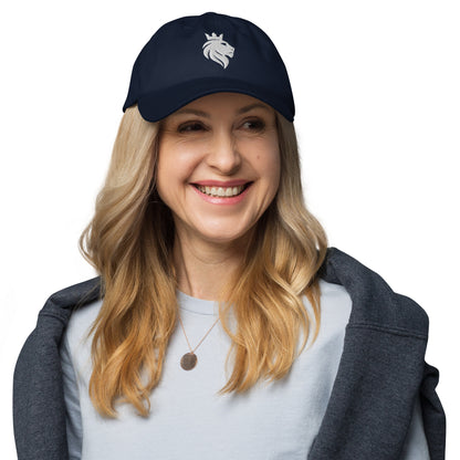 White mockup of a classic dad hat in navy blue worn by a model, for wid Designs.