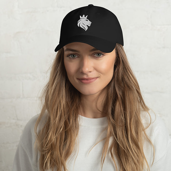 Female model wearing the Still Lion black dad hat, front view.